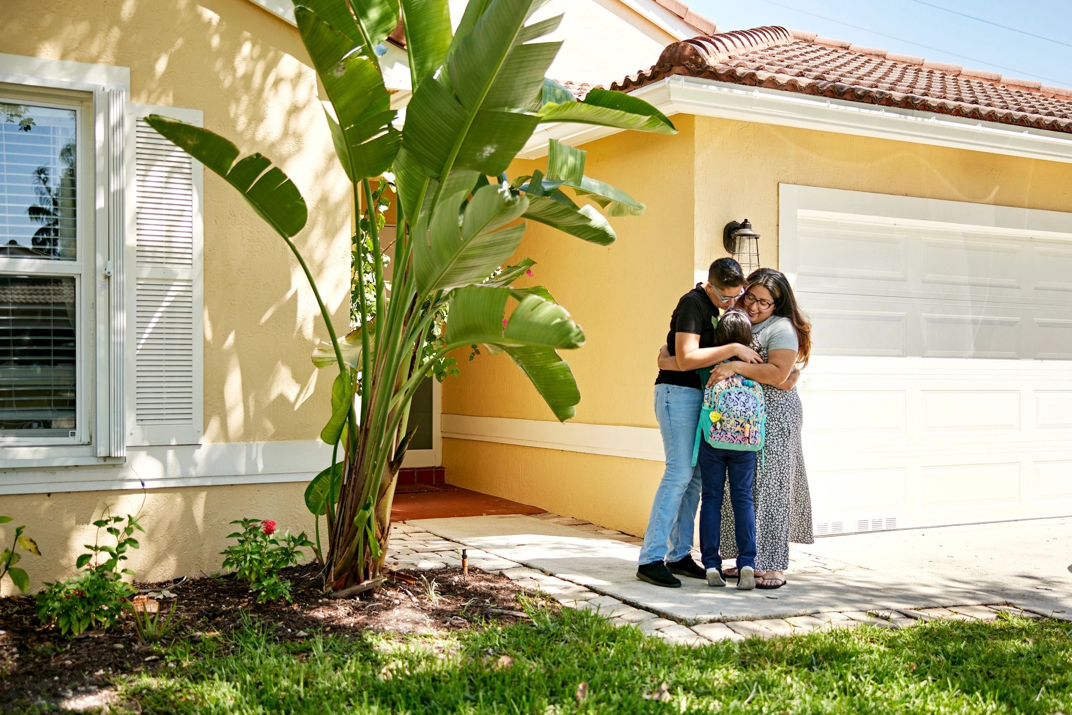 Family leaving home together, representing personal insurance protection