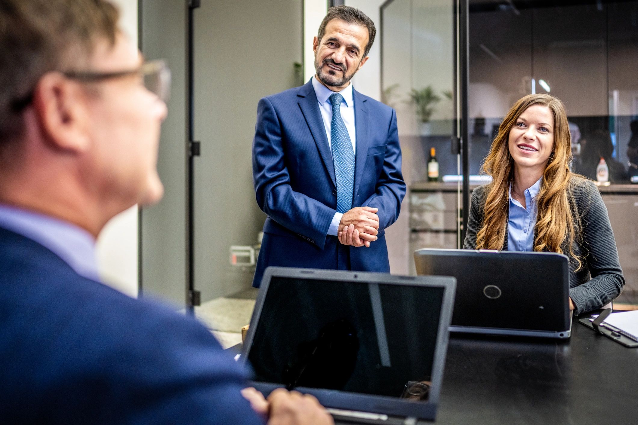 Business partners discussing insurance and protection planning in a meeting room